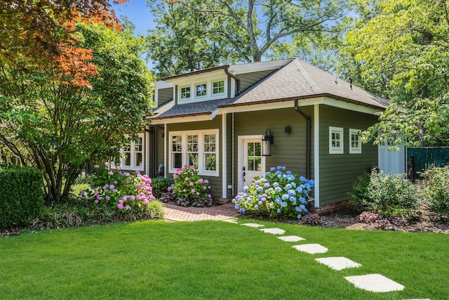 120 Cambon Ave, Saint James, NY 11780 - view of front of property featuring roof with shingles and a front lawn