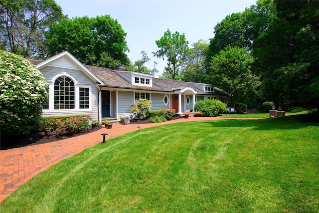 100 Gristmill Ln, Manhasset, NY 11030 - ranch-style house with a front yard and a chimney