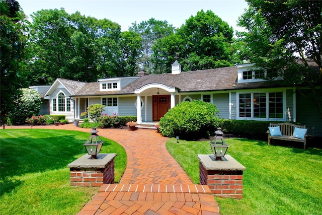 100 Gristmill Ln, Manhasset, NY 11030 - view of front of property featuring a front lawn and a chimney