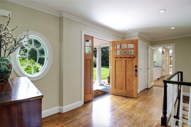 100 Gristmill Ln, Manhasset, NY 11030 - entryway featuring decorative columns, light wood-type flooring, recessed lighting, and crown molding