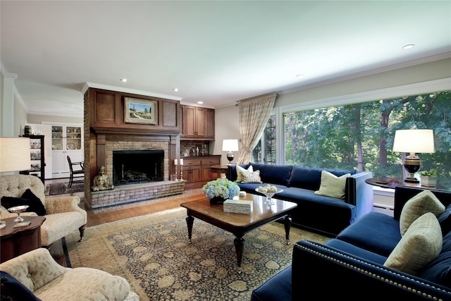 100 Gristmill Ln, Manhasset, NY 11030 - living room with crown molding, a baseboard radiator, wood finished floors, a fireplace, and recessed lighting