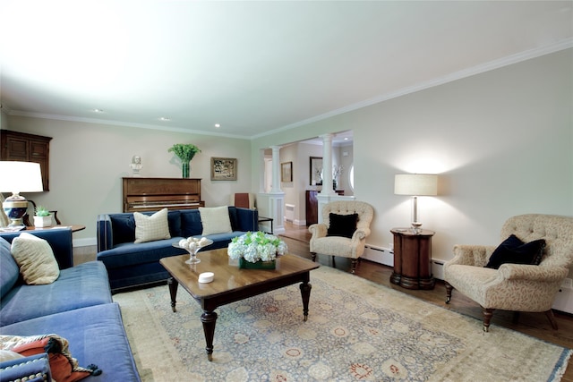 100 Gristmill Ln, Manhasset, NY 11030 - living room featuring decorative columns, light wood-style flooring, crown molding, a baseboard heating unit, and recessed lighting