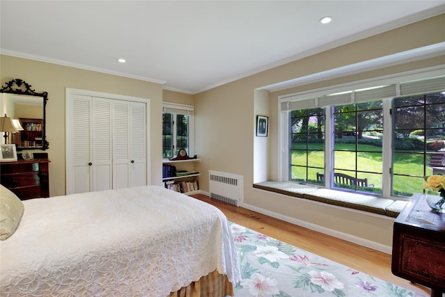 100 Gristmill Ln, Manhasset, NY 11030 - bedroom featuring radiator, wood finished floors, ornamental molding, a closet, and recessed lighting