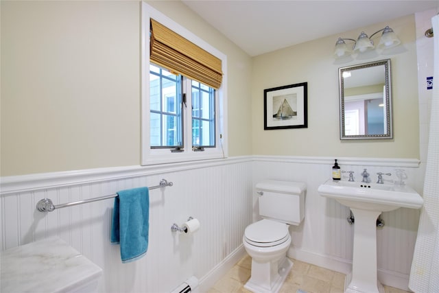 100 Gristmill Ln, Manhasset, NY 11030 - bathroom with a wainscoted wall and tile patterned flooring