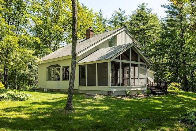 66 Beacon Hill Rd, Call Listing Agent, NY 12060 - view of front of home featuring a shingled roof, a sunroom, a chimney, and a front yard