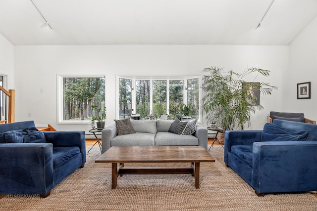 66 Beacon Hill Rd, Call Listing Agent, NY 12060 - living room with track lighting, stairway, light wood-style flooring, and baseboard heating