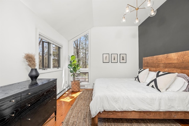 66 Beacon Hill Rd, Call Listing Agent, NY 12060 - bedroom with baseboard heating, light wood finished floors, lofted ceiling, and a chandelier