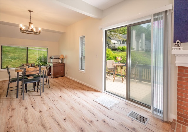 331 Heritage Hls Unit A, Somers, NY 10589 - dining room featuring wood finished floors, a chandelier, baseboards, and beam ceiling