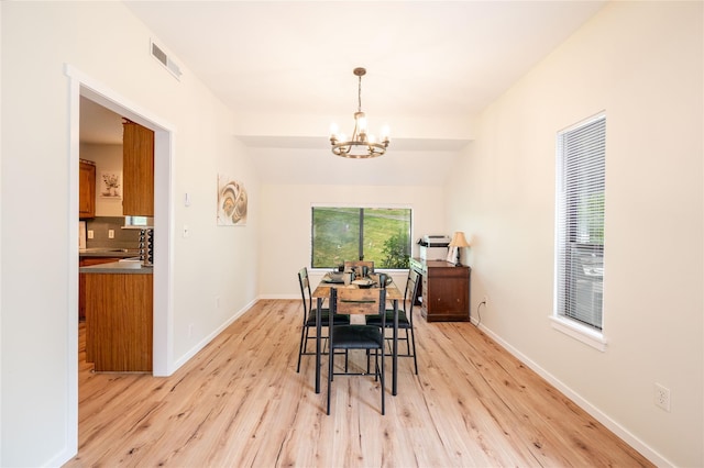 331 Heritage Hls Unit A, Somers, NY 10589 - dining room featuring a chandelier, light wood-type flooring, and baseboards