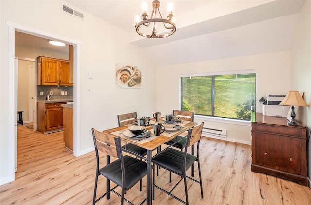 331 Heritage Hls Unit A, Somers, NY 10589 - dining space featuring a baseboard radiator, a chandelier, light wood-style flooring, lofted ceiling, and baseboards