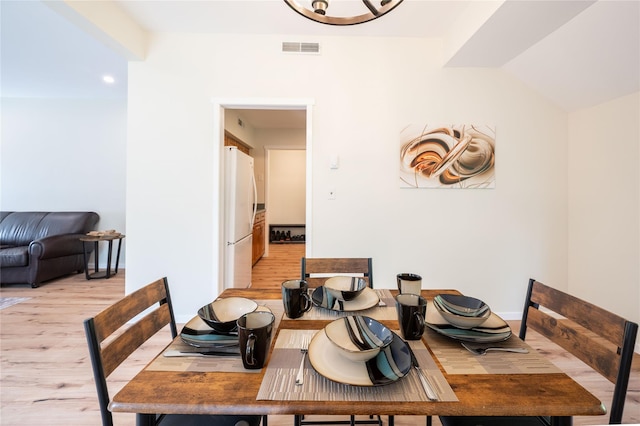 331 Heritage Hls Unit A, Somers, NY 10589 - dining room featuring light wood finished floors and lofted ceiling