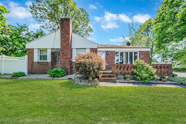 191 Laurel Rd, East Northport, NY 11731 - view of front of property featuring a chimney and brick siding