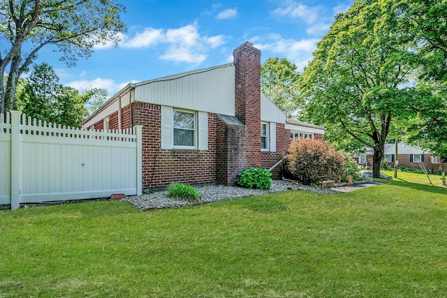 191 Laurel Rd, East Northport, NY 11731 - view of property exterior featuring a chimney and brick siding