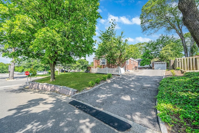 191 Laurel Rd, East Northport, NY 11731 - view of property hidden behind natural elements with driveway and covered porch