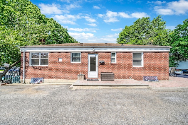 191 Laurel Rd, East Northport, NY 11731 - rear view of property with a patio area and brick siding