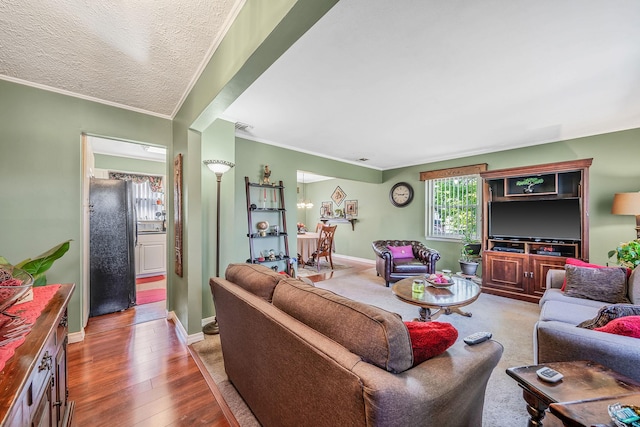 191 Laurel Rd, East Northport, NY 11731 - living area featuring ornamental molding, wood-type flooring, and baseboards