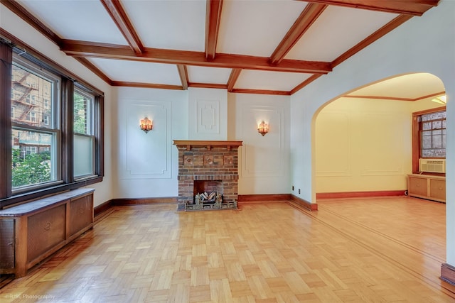 3916 51st St, Woodside, NY 11377 - unfurnished living room featuring arched walkways, a fireplace, beamed ceiling, and crown molding