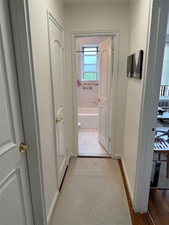 18-50 211th St Unit 6C, Bayside, NY 11360 - hallway featuring baseboards