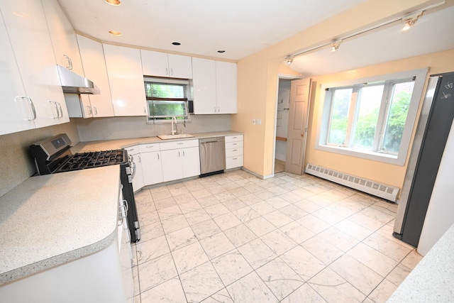 1078 Hancock Ave, Franklin Square, NY 11010 - kitchen with stainless steel appliances, a baseboard heating unit, under cabinet range hood, light countertops, and white cabinetry