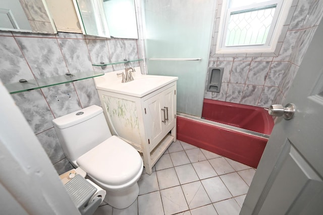 1078 Hancock Ave, Franklin Square, NY 11010 - bathroom featuring vanity, bathing tub / shower combination, tile patterned floors, and tile walls