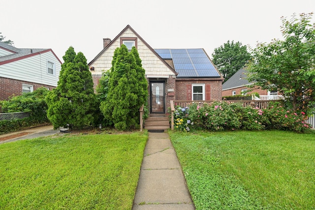 1078 Hancock Ave, Franklin Square, NY 11010 - view of front of home featuring solar panels and brick siding