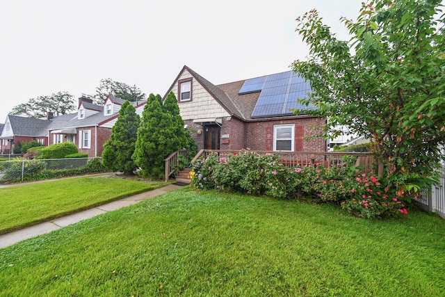 1078 Hancock Ave, Franklin Square, NY 11010 - view of front of house with brick siding and roof mounted solar panels