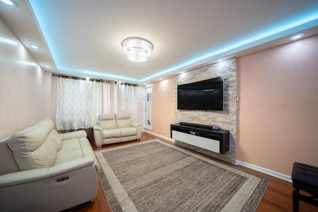 98-40 64th Ave Unit 1B, Rego Park, NY 11374 - living area featuring a raised ceiling, wood finished floors, a fireplace, and recessed lighting