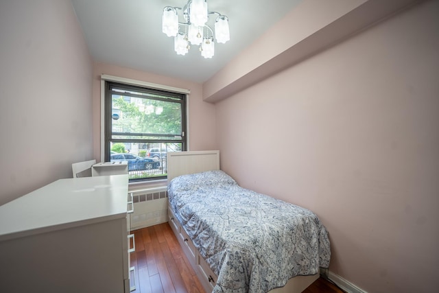 98-40 64th Ave Unit 1B, Rego Park, NY 11374 - bedroom featuring a chandelier, hardwood / wood-style floors, and radiator heating unit