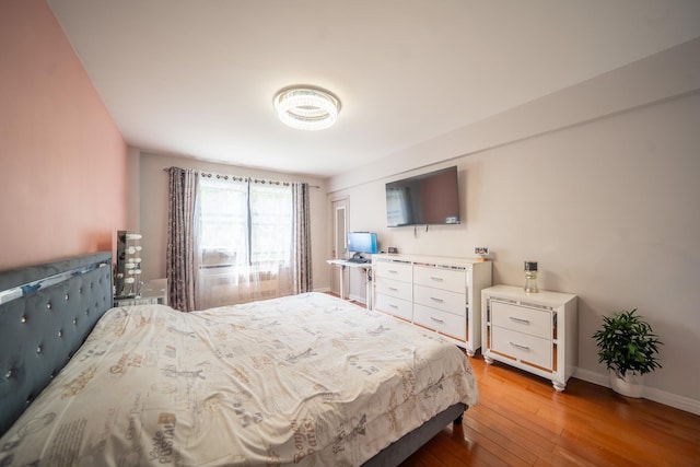 98-40 64th Ave Unit 1B, Rego Park, NY 11374 - bedroom featuring light wood finished floors and baseboards
