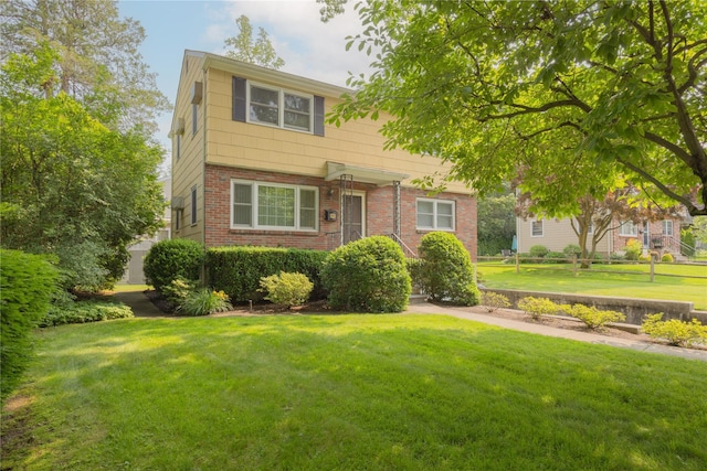 17 Shady Ln, Scarsdale, NY 10583 - view of front of home featuring a front lawn and brick siding