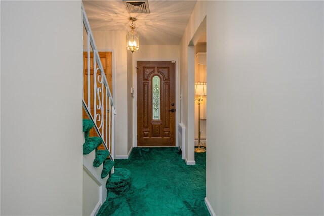 17 Shady Ln, Scarsdale, NY 10583 - foyer entrance with carpet, stairway, and a chandelier