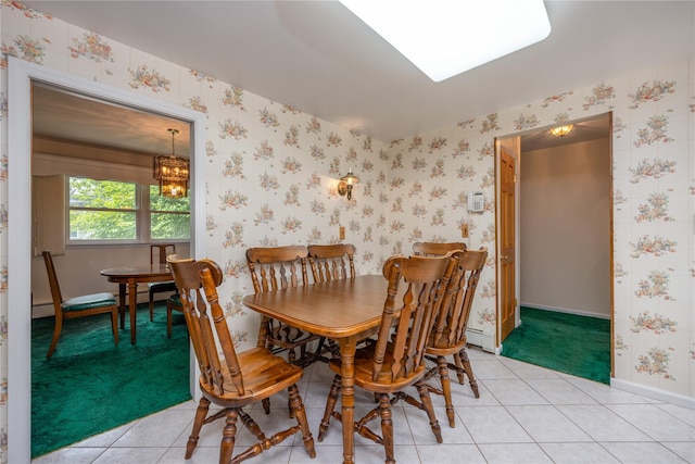 17 Shady Ln, Scarsdale, NY 10583 - dining area with wallpapered walls, light tile patterned floors, a chandelier, and a baseboard radiator