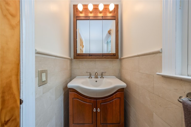 17 Shady Ln, Scarsdale, NY 10583 - bathroom featuring vanity, a wainscoted wall, and tile walls