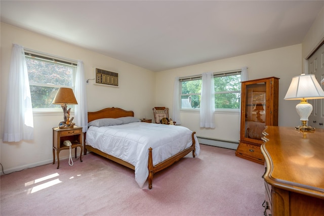 17 Shady Ln, Scarsdale, NY 10583 - bedroom featuring a baseboard heating unit, light colored carpet, and a wall mounted air conditioner