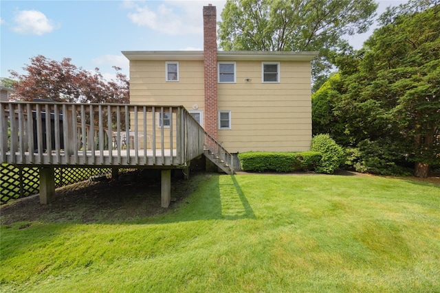 17 Shady Ln, Scarsdale, NY 10583 - rear view of house with a lawn, a wooden deck, and a chimney