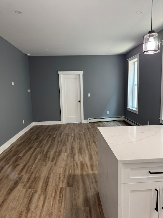 1140 Sutter Ave, Brooklyn, NY 11208 - unfurnished dining area with baseboard heating, dark wood-style flooring, and recessed lighting