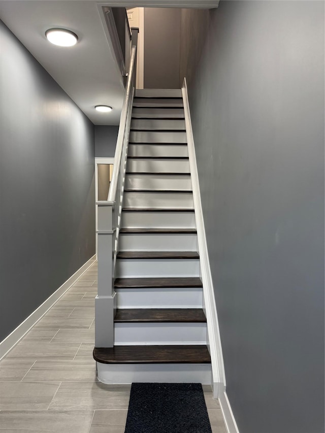 1140 Sutter Ave, Brooklyn, NY 11208 - staircase featuring baseboards