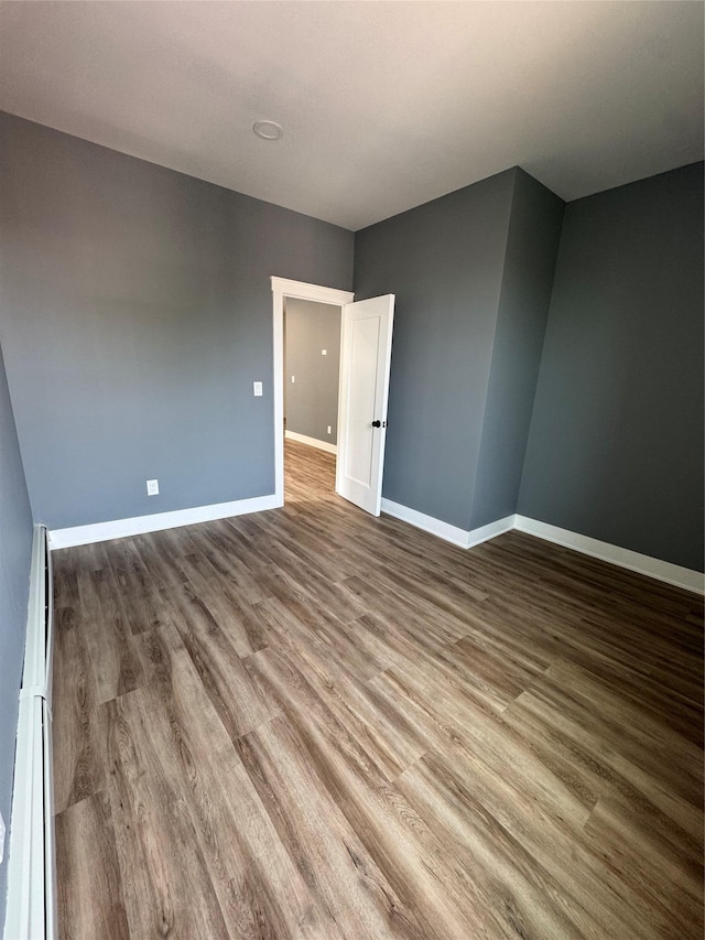 1140 Sutter Ave, Brooklyn, NY 11208 - empty room featuring wood finished floors and a baseboard radiator