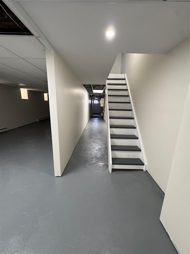 1140 Sutter Ave, Brooklyn, NY 11208 - finished basement featuring stairs and a baseboard heating unit
