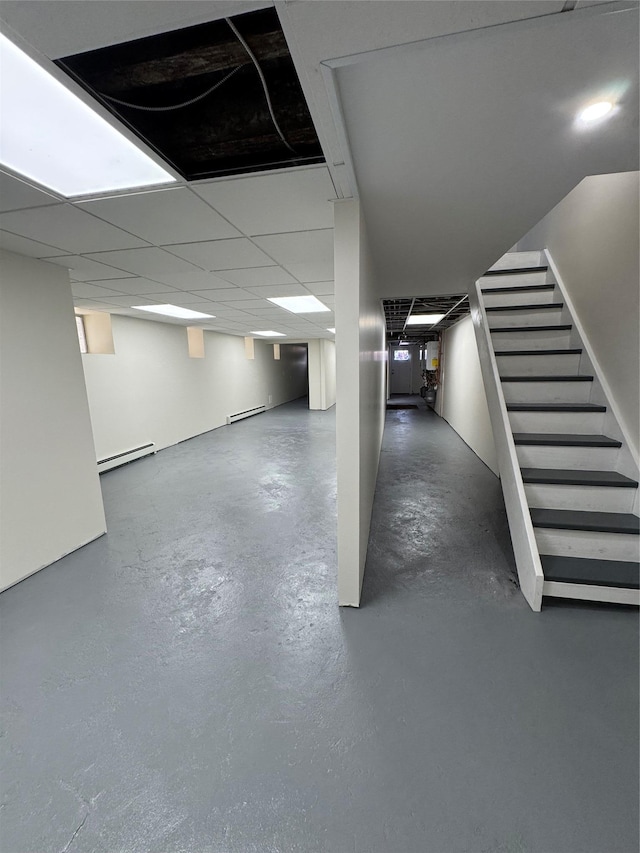1140 Sutter Ave, Brooklyn, NY 11208 - finished basement featuring baseboard heating, stairs, and a baseboard radiator