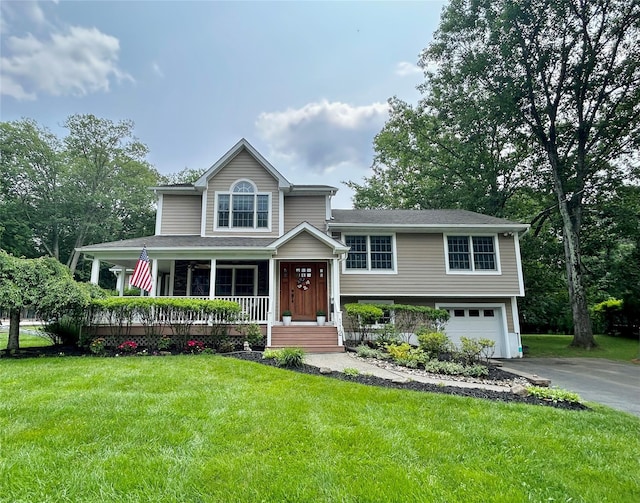 112 E George Ave, Pearl River, NY 10965 - tri-level home featuring covered porch, asphalt driveway, an attached garage, and a front yard