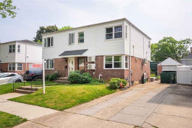 67-15 214th St, Bayside, NY 11364 - view of front facade with brick siding and a gate