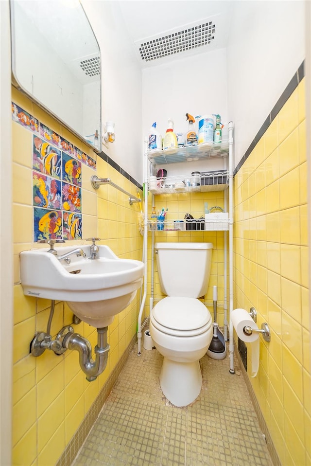 67-15 214th St, Bayside, NY 11364 - half bath with tile walls and a wainscoted wall