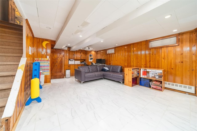67-15 214th St, Bayside, NY 11364 - living area with wooden walls, stairs, marble look tile flooring, and recessed lighting