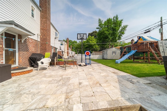67-15 214th St, Bayside, NY 11364 - view of patio featuring a playground, area for grilling, and a shed
