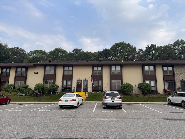 10 Palm Ct Unit 10, Selden, NY 11784 - view of building exterior with uncovered parking