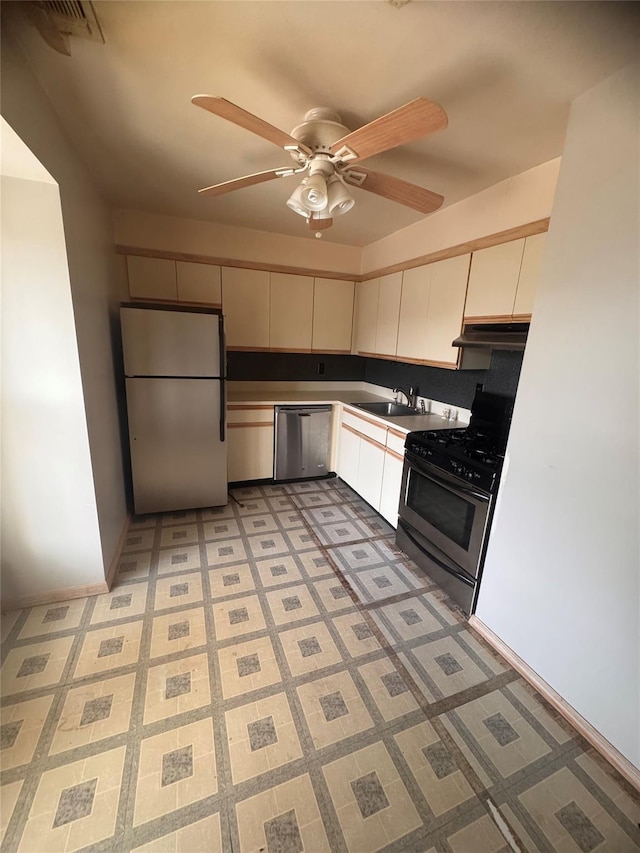 10 Palm Ct Unit 10, Selden, NY 11784 - kitchen featuring appliances with stainless steel finishes, under cabinet range hood, a ceiling fan, light flooring, and white cabinets