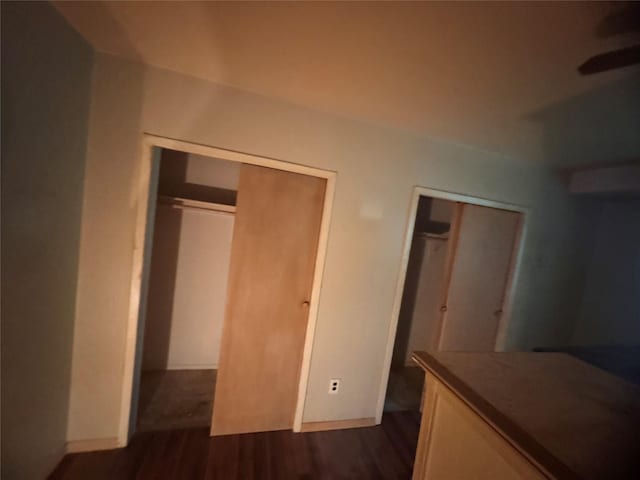 10 Palm Ct Unit 10, Selden, NY 11784 - unfurnished bedroom with dark wood-style floors and baseboards