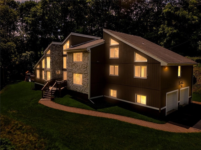 4 S Hill Rd, Tomkins Cove, NY 10986 - view of home's exterior with stone siding, a lawn, a shingled roof, asphalt driveway, and a garage