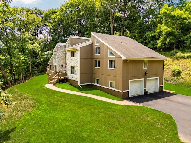 4 S Hill Rd, Tomkins Cove, NY 10986 - view of home's exterior featuring a garage, a yard, asphalt driveway, and view of wooded area